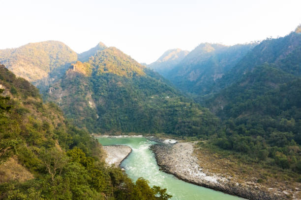 istock Stunning view of some green mountain peaks with the Sacred Ganges River flowing between them in Rishikesh, India. 1152296754