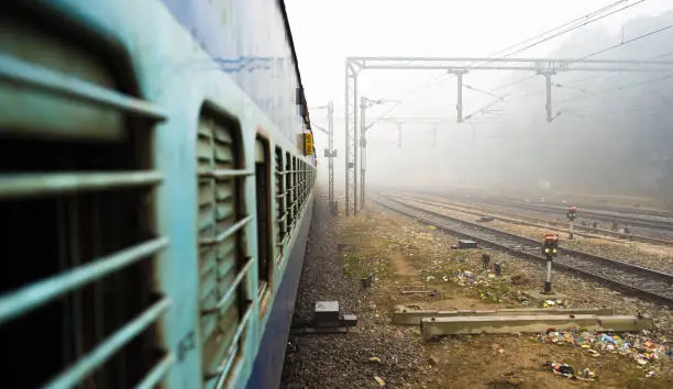 View through the window train in the polluted city of New Delhi, India. Indian Railways, often described as the Òtransport lifeline of the nationÓ, is the fourth largest railway network in the world.