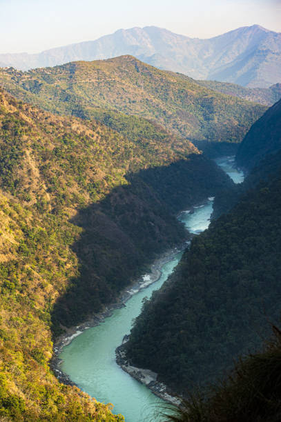istock Stunning view of some green mountain peaks with the Sacred Ganges River flowing between them in Rishikesh, India. 1152297632