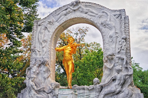 VIENNA, AUSTRIA - 2 October 2018: Johann Strauss monument in Stadtpark, Vienna, Austria. Golden statue of great Austrian composer, Waltz King, playing violin