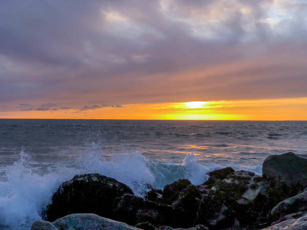 istock Sunset over the pacific ocean under storm clouds in Venice, CA 1152303210