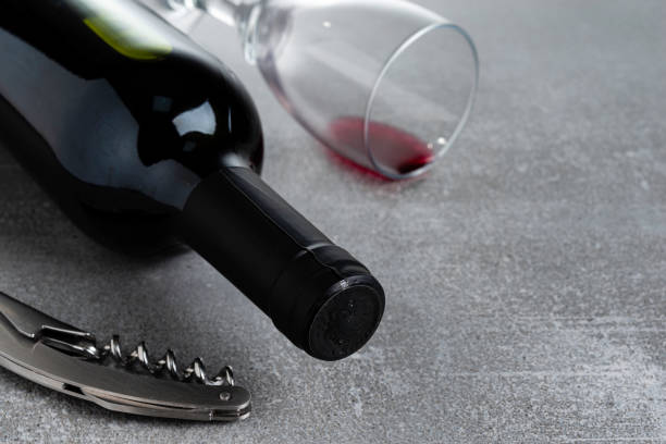 istock Bottle of wine on gray concrete 1152305123