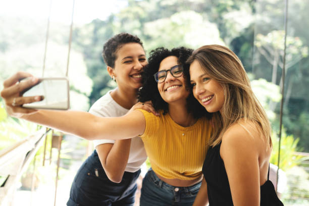istock Good friends spending time together and having fun, taking selfies 1152305143