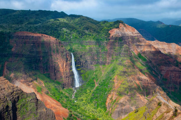 Waipo'o Falls 800 foot tall Waipo'o Falls in Wiamea Canyon, Kawaii, Hawaii. robertmichaud stock pictures, royalty-free photos & images