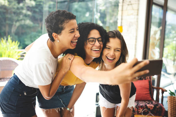istock Good friends spending time together and having fun, taking selfies 1152306009