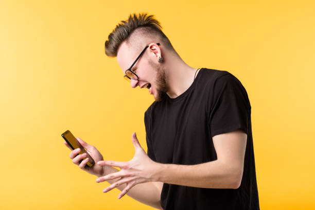 istock wtf young man screaming smartphone grimacing 1152310153
