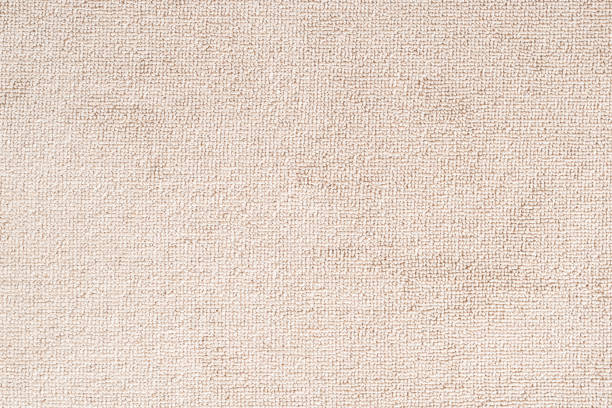 dywan dywanu lub ręcznik plażowy tekstury tła w kolorze beżowym wykonane z wełny lub włókien syntetycznych, polipropylenu, nylonu lub poliestru - rug carpet decor woven zdjęcia i obrazy z banku zdjęć