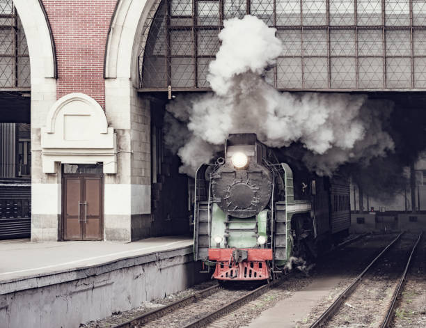 istock Retro train departs from the railway station. 1152311654
