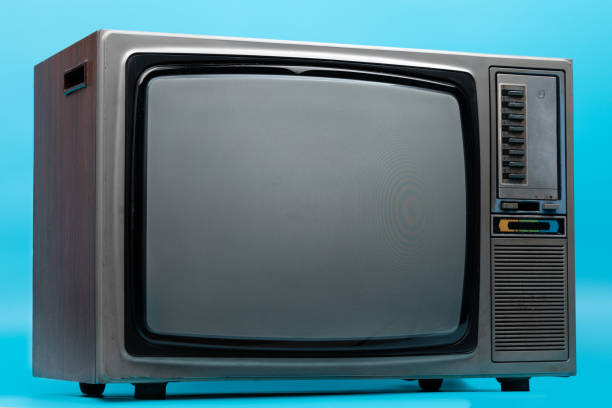 istock Vintage TV : old retro TV set isolated on blue background. 1152313611