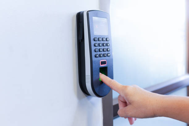 istock The employee scanning fingerprint to record working time 1152315262