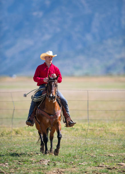 istock Cowboy galloping in Utah, USA 1152315523