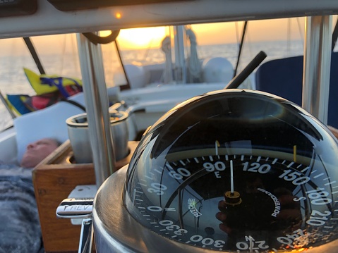 Compass at sunrise on the sea