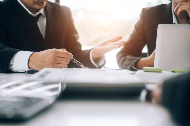 istock Business people analyzing investment graph meeting brainstorming and discussing plan in meeting room, investment concept 1152322032