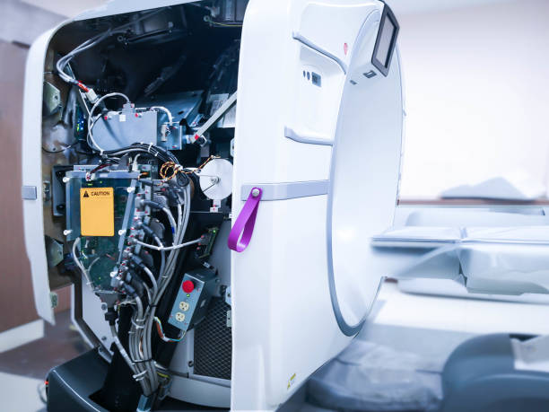 After Maintenance engineer repairing and checking CT scanner machine showing engine inside CT scanner. stock photo
