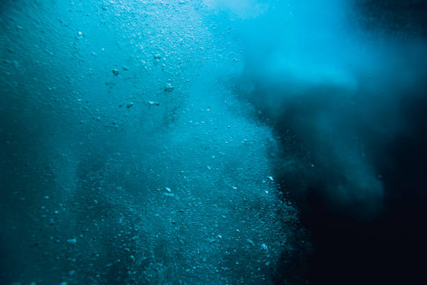 istock Wave underwater with air bubbles. Blue crystal ocean in underwater 1152326235