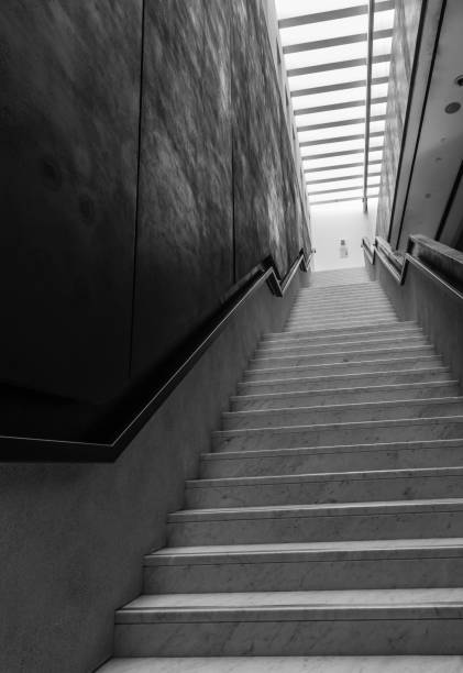 istock black color long stairs with glass sky window 1152327212