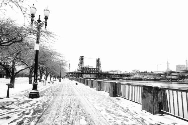 Waterfront walkway in winter covered in snow Portland Oregon