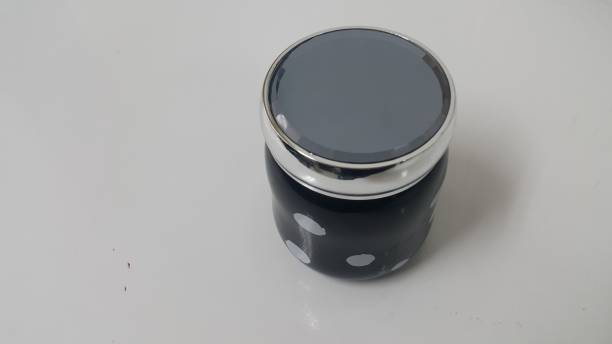 istock Beautiful coffee black mug with white dots placed over white floor with black lid on it. 1152329682