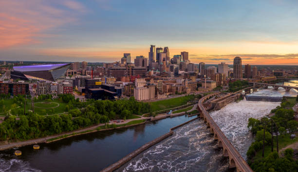 Minneapolis From Above at Sunset Aerial View of Minneapolis and St.Anthony Falls at Dusk - May 2019 minnesota stock pictures, royalty-free photos & images