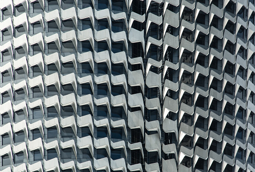 Abstract detail of the aluminum fins decorating the front facade in Singapore CBD area