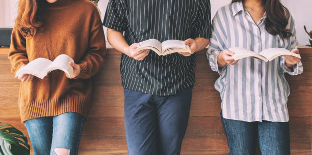 people standing and enjoyed reading books together