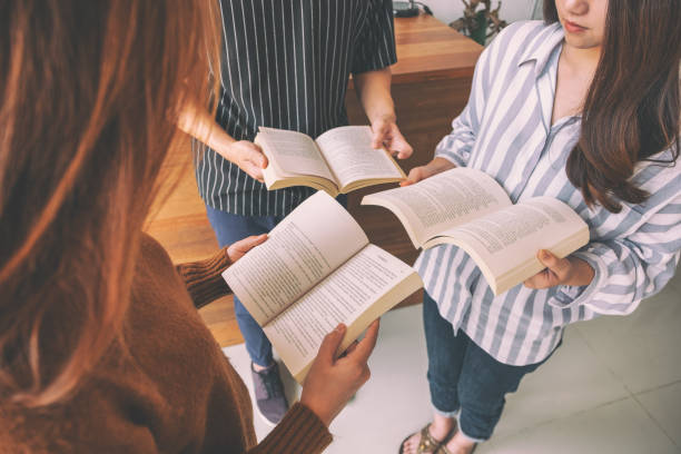 istock people standing in circle and enjoyed reading books together 1152333269