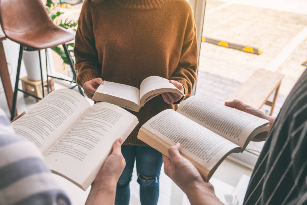 istock people standing in circle and enjoyed reading books together 1152333283