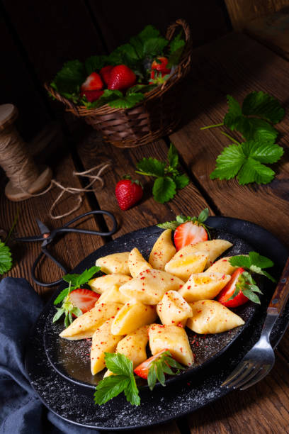 istock Kopytka - polish potato dumpling with strawberries 1152336657