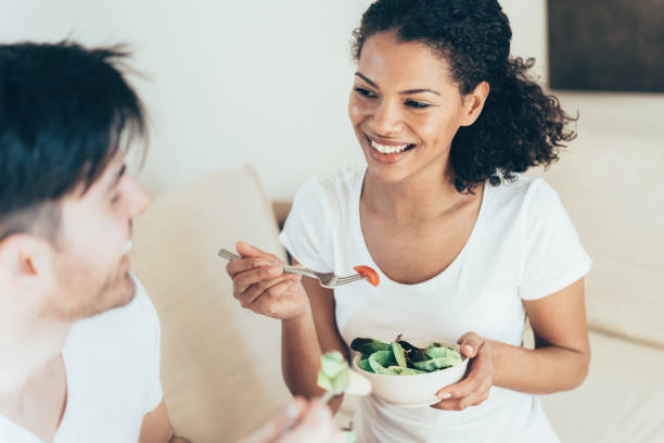 istock Couple in love eating salad 1152337623