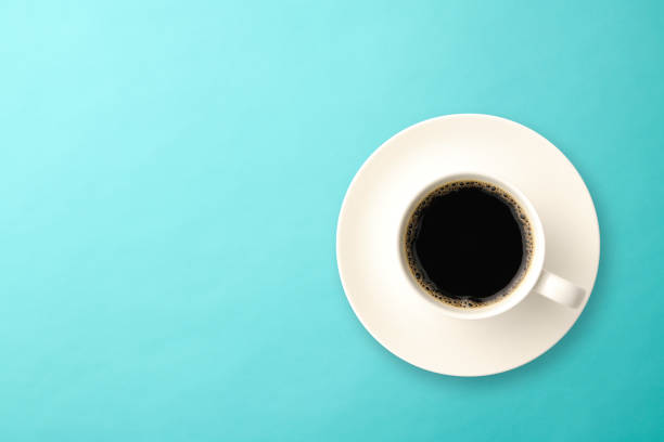 istock A cup of coffee on light blue background 1152337707