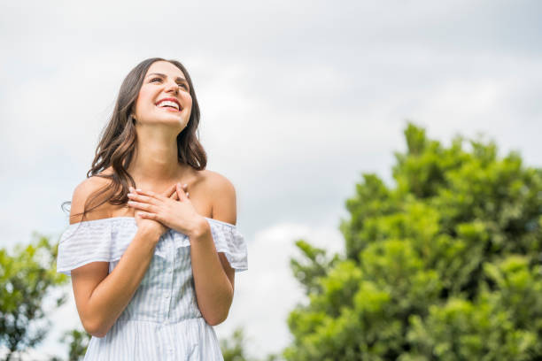 istock Smiling woman in the park 1152338673