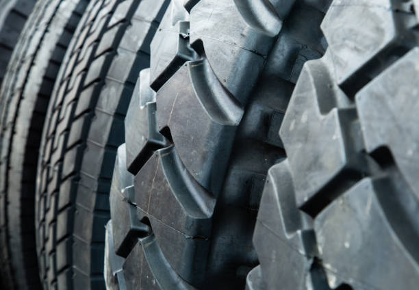 istock Deteriorated and cracked wheel tire closeup 1152340282