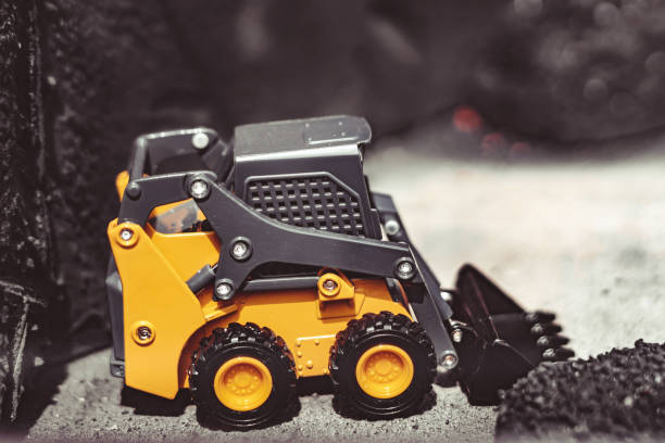 istock toy tractor in the scenery of coal mining 1152341352