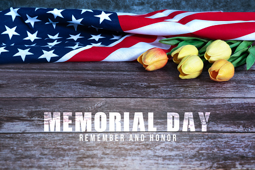 Memorial Day with American flag and flower on wooden background