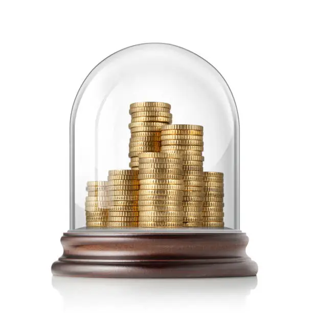 Pile of golden coins in glass bell jar on white background.