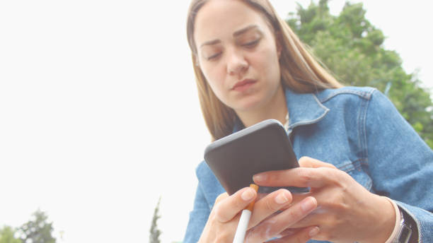 istock Young woman on her coffee break in the park 1152347694