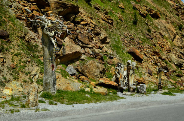 Kaunertal, Austria - June 22, 2014: Funny wooden sculptures along the Kaunertaler glacier road in Tirol