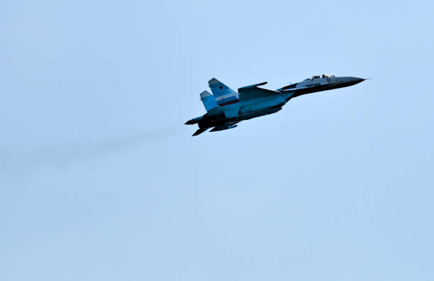 Flying SU-27 fighter stock photo