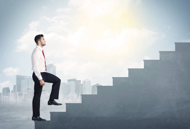 istock Businessman climbing up a concrete staircase concept 1152348903