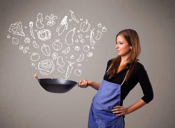 istock Woman cooking vegetables 1152348982