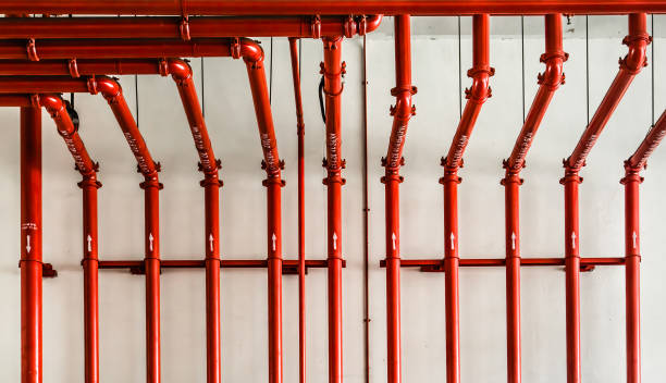 istock red color metal pipe on white wall 1152349636