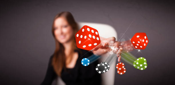 istock Young woman throwing dices and chips 1152349823