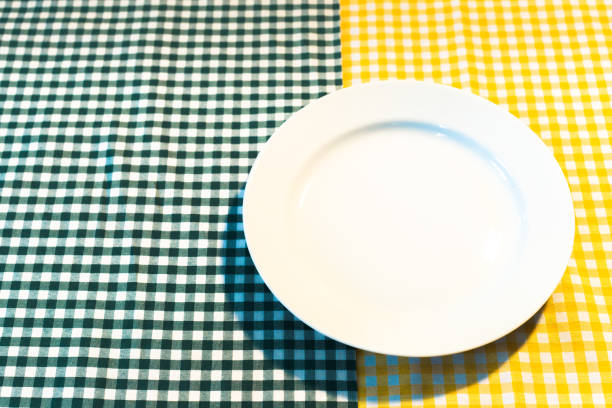 istock the plate on yellow checkered table cloth 1152350395
