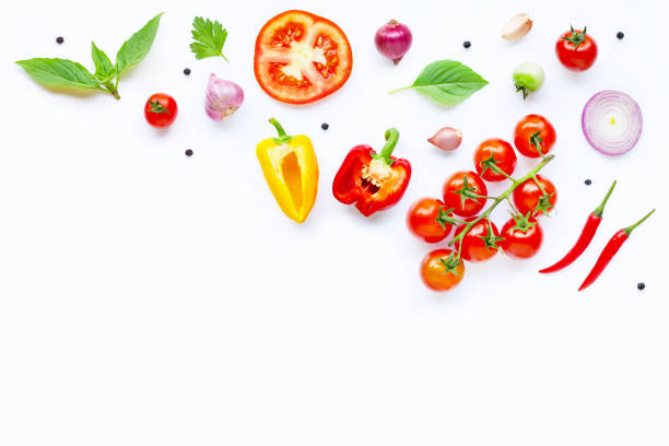 istock Various fresh vegetables and herbs on white. Healthy eating concept 1152351503