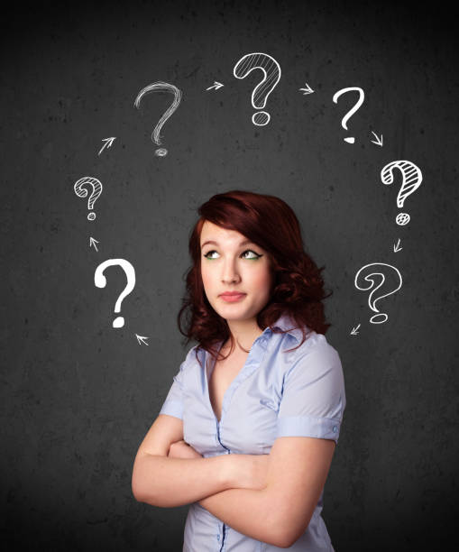 istock Young woman thinking with question mark circulation around her head 1152351511
