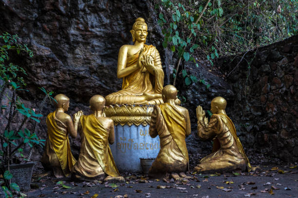 istock Buddhas along Cave on Holy Mountain Mount Phousi, Luang Prabang, Laos 1152352789