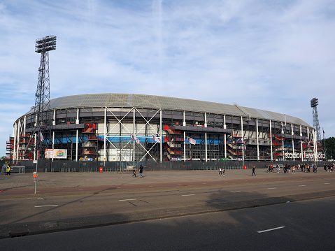 Rotterdam, Netherlands - May, 22, 2019: Feyenoord soccer stadium De Kuip in Rotterdam. Before the stadium are participants of a walking tour through Rotterdam