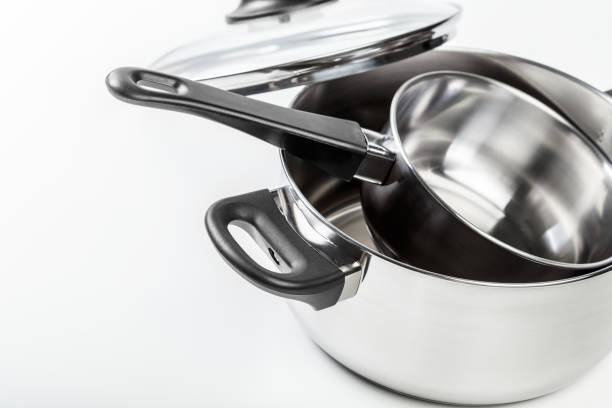 istock Stainless steel pots and pans isolated on white 1152356031