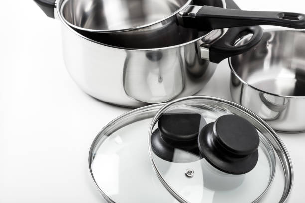 istock Stainless steel pots and pans isolated on white 1152356259