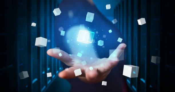 istock Person holding cube hologram projections 1152357203